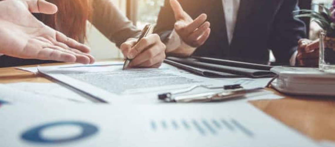 Business Signing a Contract Buy - sell house.